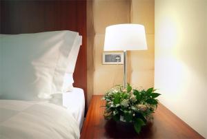 Vuode tai vuoteita majoituspaikassa Hotel Turist