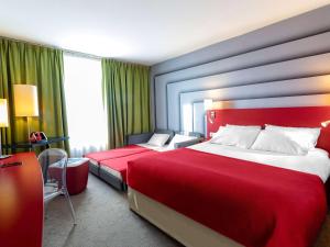 Rúm í herbergi á ibis Styles Avignon Sud