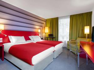 Rúm í herbergi á ibis Styles Avignon Sud