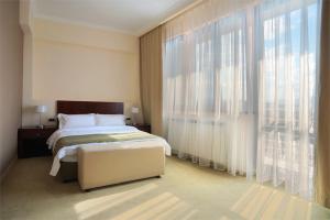 Vuode tai vuoteita majoituspaikassa Hotel Turist
