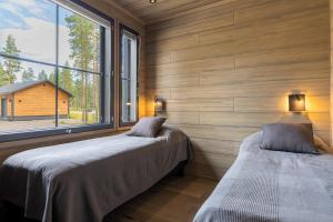 Ένα ή περισσότερα κρεβάτια σε δωμάτιο στο Villa Hankielämä B