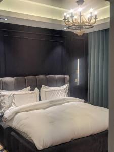 Katil atau katil-katil dalam bilik di Sujimoto Residences MacDonald