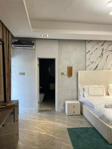 Katil atau katil-katil dalam bilik di Sujimoto Residences MacDonald
