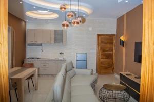 Kuchyň nebo kuchyňský kout v ubytování Appartements meublés mpita
