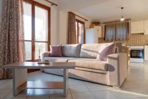 a living room with a couch and a table at Almond's Room in Mirina