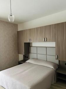 Postel nebo postele na pokoji v ubytování Cà Masawalsa Hotel + 12 fotografií
