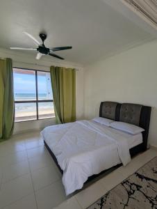 Postel nebo postele na pokoji v ubytování Pandak Inn - Your Beach Retreat + 10 fotografií