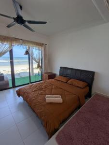 Postel nebo postele na pokoji v ubytování Pandak Inn - Your Beach Retreat