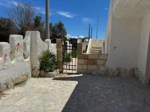 a gate to a house with a fence at DOLCE CASa 2 in Casalabate