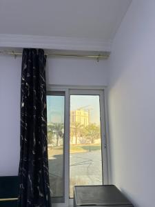 a window in a room with a curtain at Four Stars Residence in Dubai +36 photos