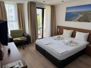 Postel nebo postele na pokoji v ubytování Family Hotel Serenity Palace