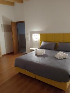 Postel nebo postele na pokoji v ubytování Hotel Garden