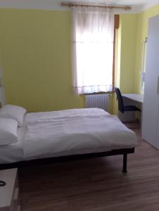 Postel nebo postele na pokoji v ubytování Hotel Garden