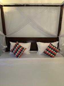 Letto o letti in una camera di Sunliya Resort
