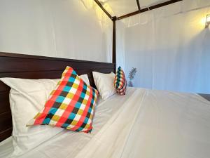 Letto o letti in una camera di Sunliya Resort