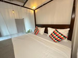 Letto o letti in una camera di Sunliya Resort