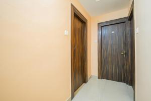 Postel nebo postele na pokoji v ubytování Super Hotel O MOHAR KUNJHA