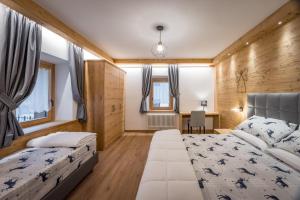 Postel nebo postele na pokoji v ubytování Il Cavallino - Albergo & Appartamenti
