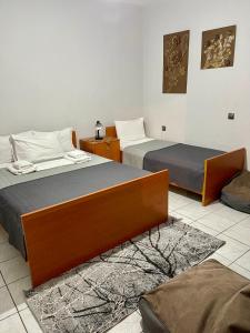 Postel nebo postele na pokoji v ubytování Guesthouse Tsoka