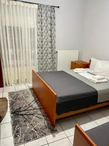 Postel nebo postele na pokoji v ubytování Guesthouse Tsoka