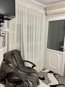 Televízia a/alebo spoločenská miestnosť v ubytovaní Guesthouse Tsoka