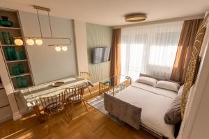 Postel nebo postele na pokoji v ubytování Apartman Platinum