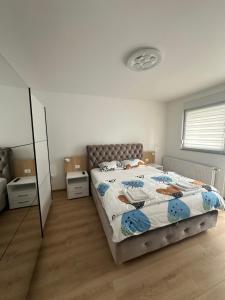 Postel nebo postele na pokoji v ubytování Apartman Aranđelovac
