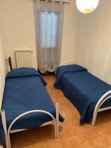 Ένα ή περισσότερα κρεβάτια σε δωμάτιο στο Casa Vacanze Palena Adventures +7 φωτογραφίες