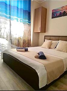 Postel nebo postele na pokoji v ubytování NordSea MAMAIA