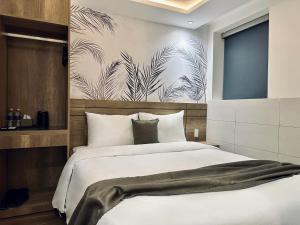 Postel nebo postele na pokoji v ubytování ON Hotel