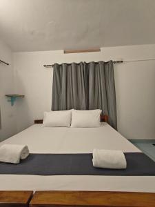 Letto o letti in una camera di Yog Hostel Varkala