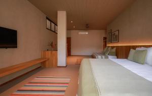 Cama ou camas em um quarto em Barracuda Boutique