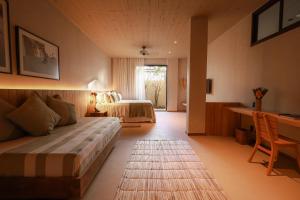 Cama ou camas em um quarto em Barracuda Boutique