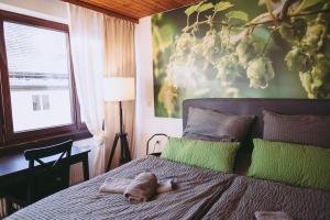 a bedroom with a bed with two towels on it at Brauereigasthof Krone Hochdorf in Nagold