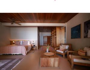 Cama ou camas em um quarto em Barracuda Boutique