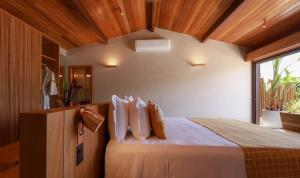 Cama ou camas em um quarto em Barracuda Boutique
