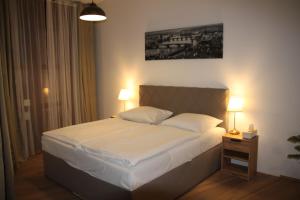 Postel nebo postele na pokoji v ubytování Aparthotel Tycho de Brahe