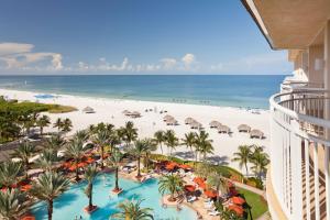 a view of the beach from the balcony of a resort at JW Marriott Marco Island Beach Resort in Marco Island