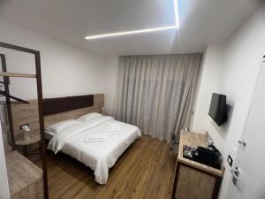 Postel nebo postele na pokoji v ubytování B&B La Quarantola