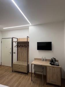 TV a/nebo společenská místnost v ubytování B&B La Quarantola