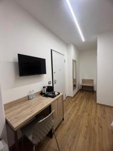 TV a/nebo společenská místnost v ubytování B&B La Quarantola