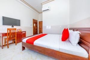 Postel nebo postele na pokoji v ubytování Magnolia Hotel Cam Ranh