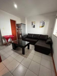 a living room with a couch and a coffee table at Colibri MDQ in Mar del Plata