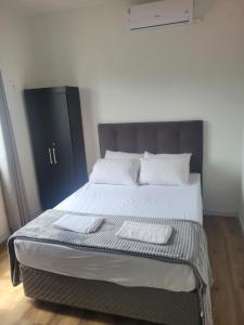Ένα ή περισσότερα κρεβάτια σε δωμάτιο στο Apartamento praia navegantes sc