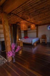 Postel nebo postele na pokoji v ubytování Ecohotel Alflo Inn