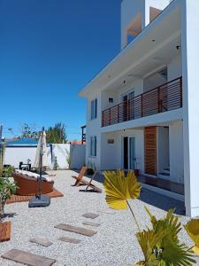 a view of a house with a patio at Nalu in Passo De Torres