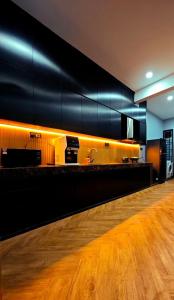 a bar with a wooden floor in a room at Zen at Austin - Sleep 13 Pax-10 Min to Aeon Tebrau in Johor Bahru