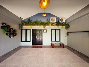 a large room with a door and plants on the wall at Zen at Austin - Sleep 13 Pax-10 Min to Aeon Tebrau in Johor Bahru