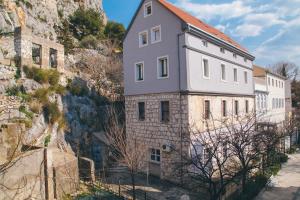 a house on the side of a mountain at Apartment Aldo in Omiš