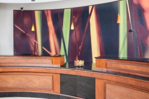 a courtroom with two wooden cabinets and a table at SpringHill Suites by Marriott Norfolk Virginia Beach in Virginia Beach